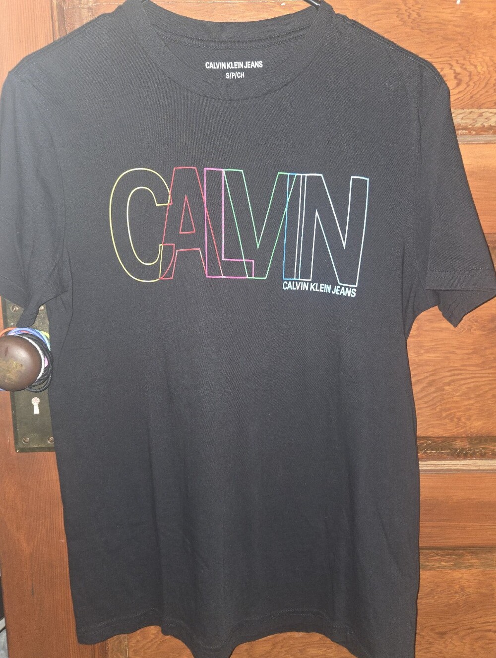 Calvin Klein Jeans Black Tee with Multicolor Outlined CALVIN Logo